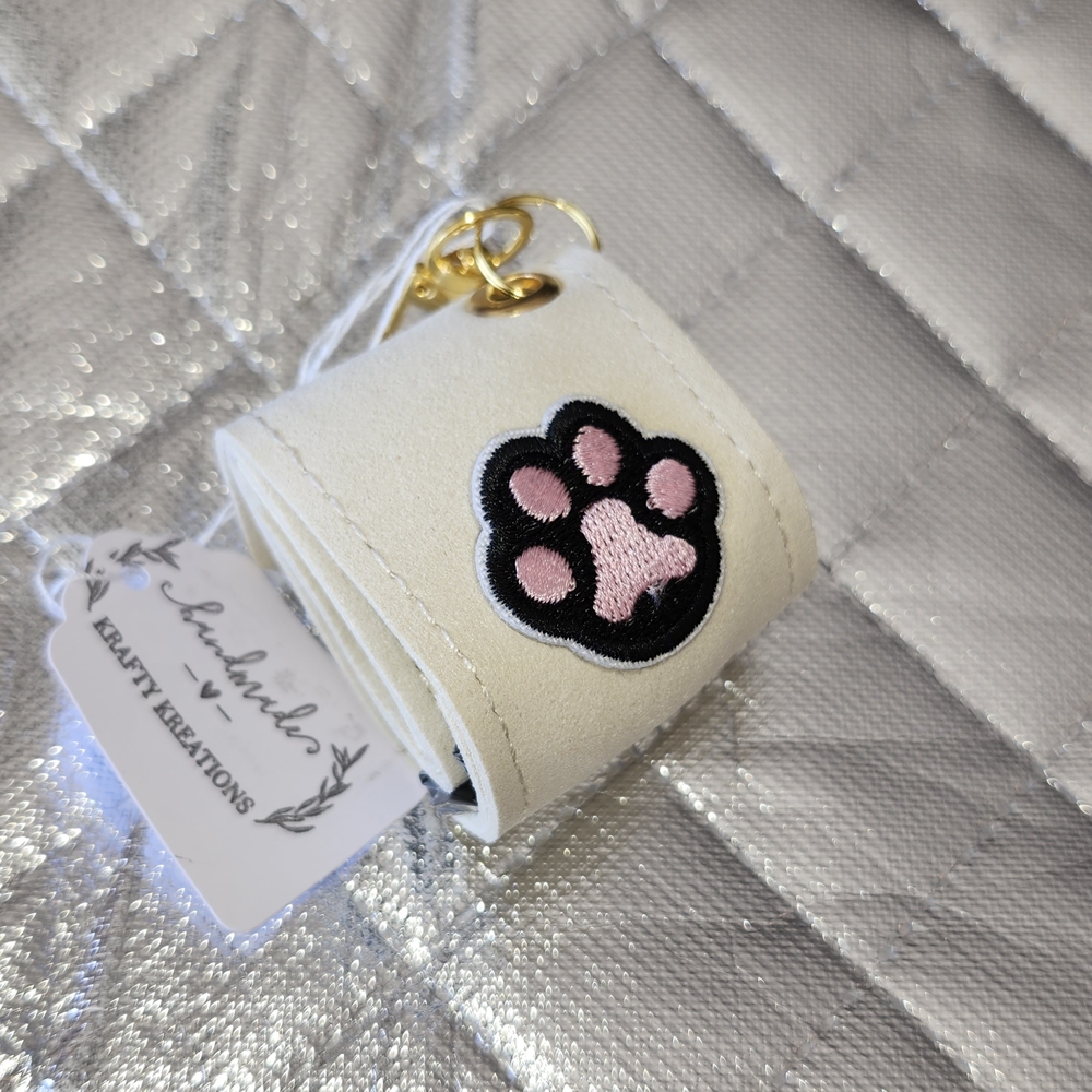 Hand Crafted Cream Poopie Bag Holder Key Chain with Pink Paw Design
